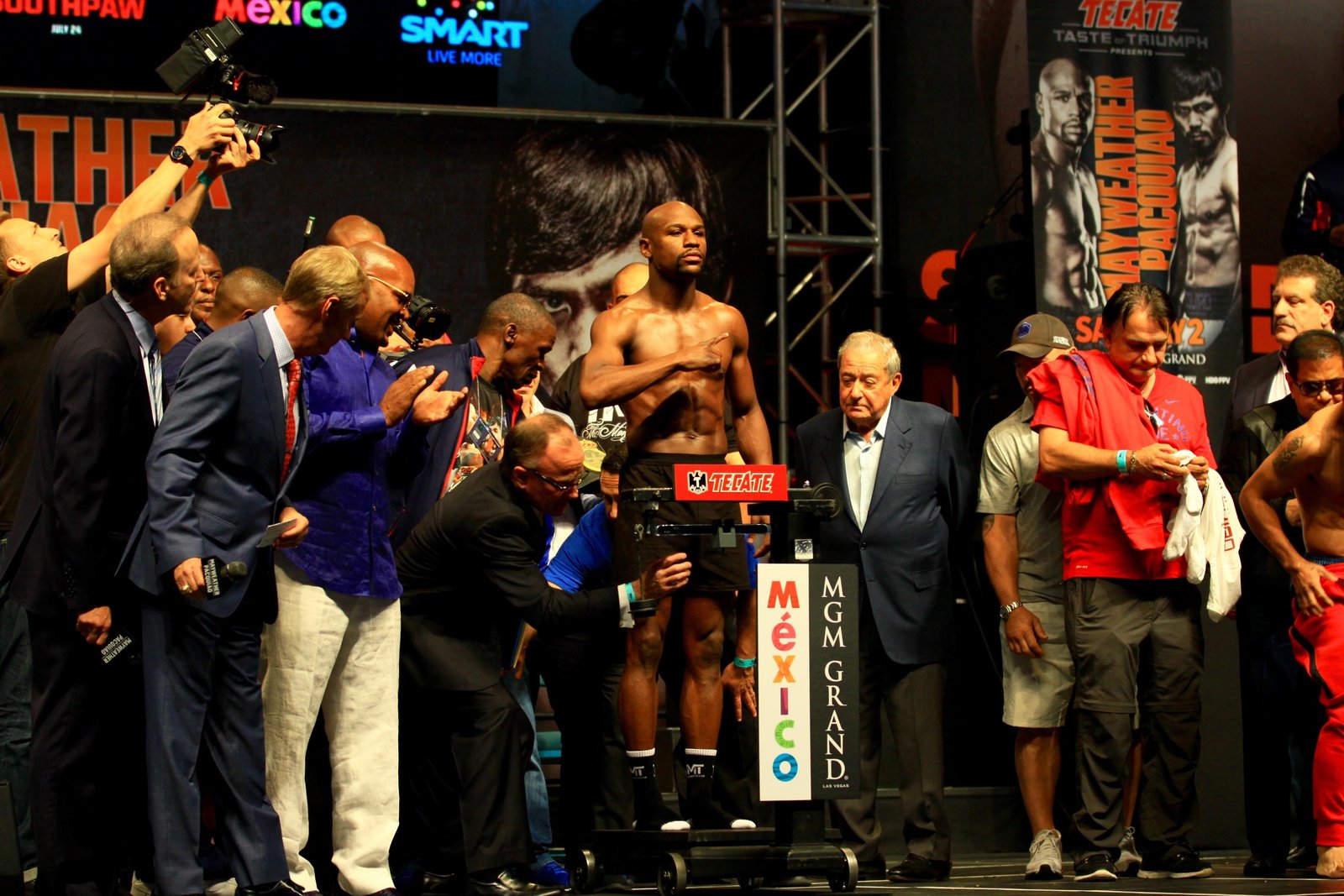 Floyd Mayweather standing on the scale at the 2015 weigh-in for his fight against Manny Pacquiao in Las Vegas